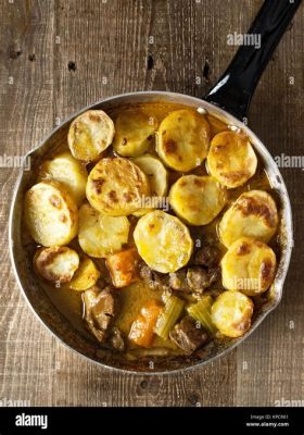  Le Lancashire Hotpot: Une symphonie épicurienne de saveurs rustiques et d'arômes réconfortants!